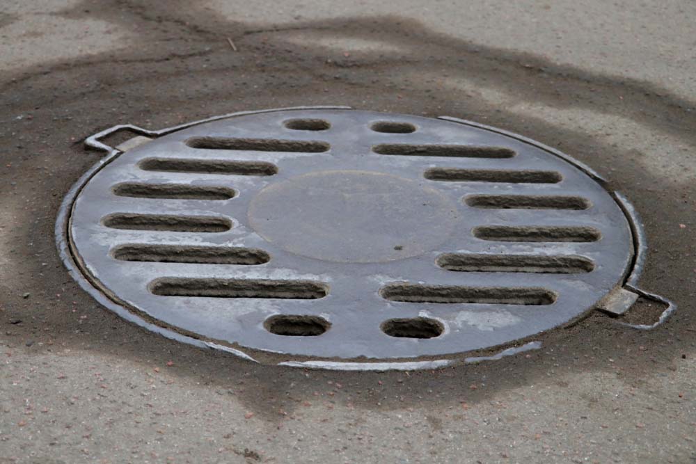 Storm drainage manhole cover